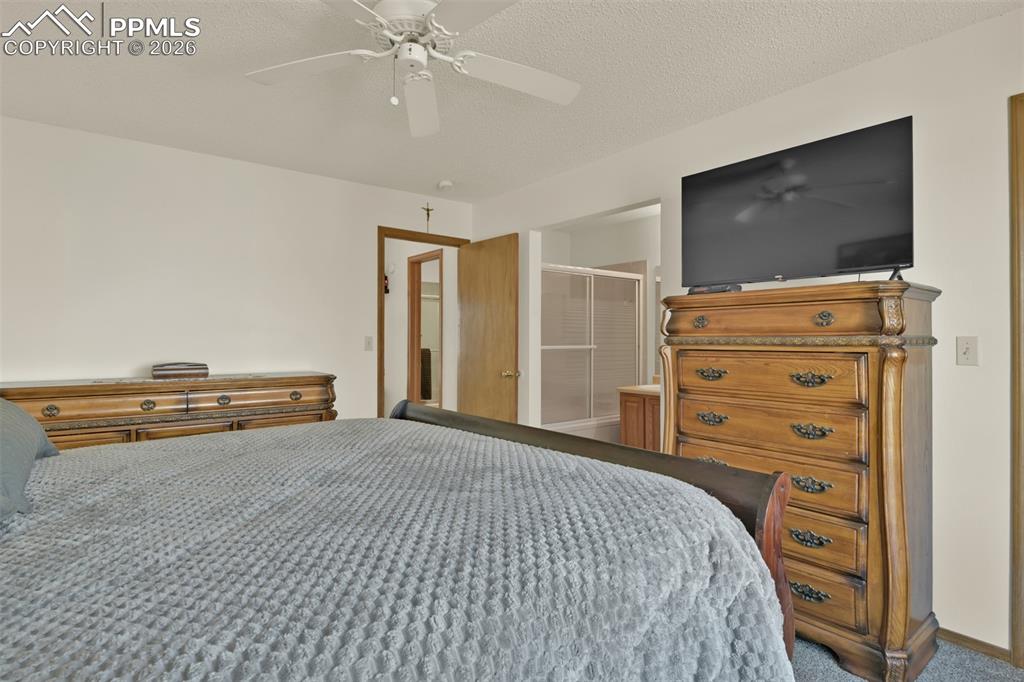 Image 18 of 38: Primary Bedroom Suite with private full bathroom.