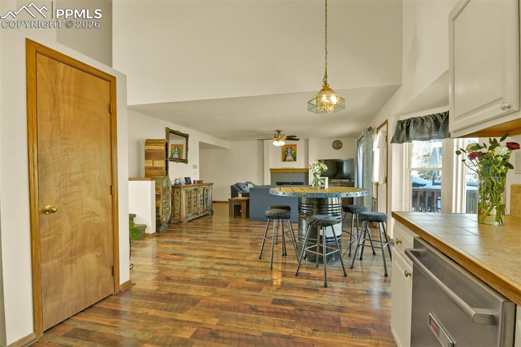 Image 9 of 38: Opposite View of the Kitchen into great room style dining and family room.