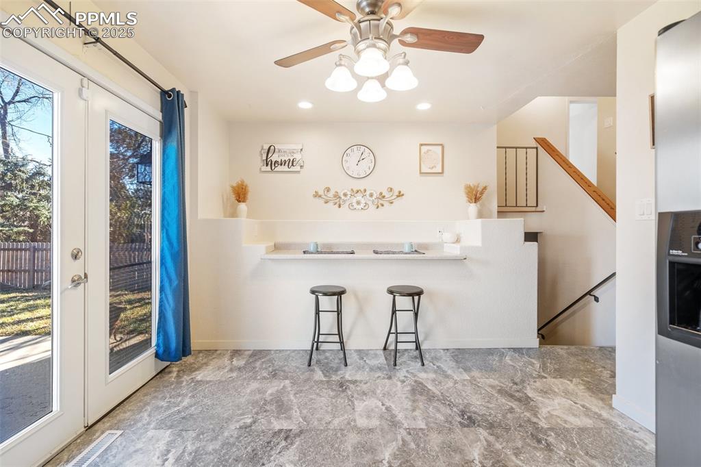 Image 6 of 26: Eat-in nook and walk-out to patio