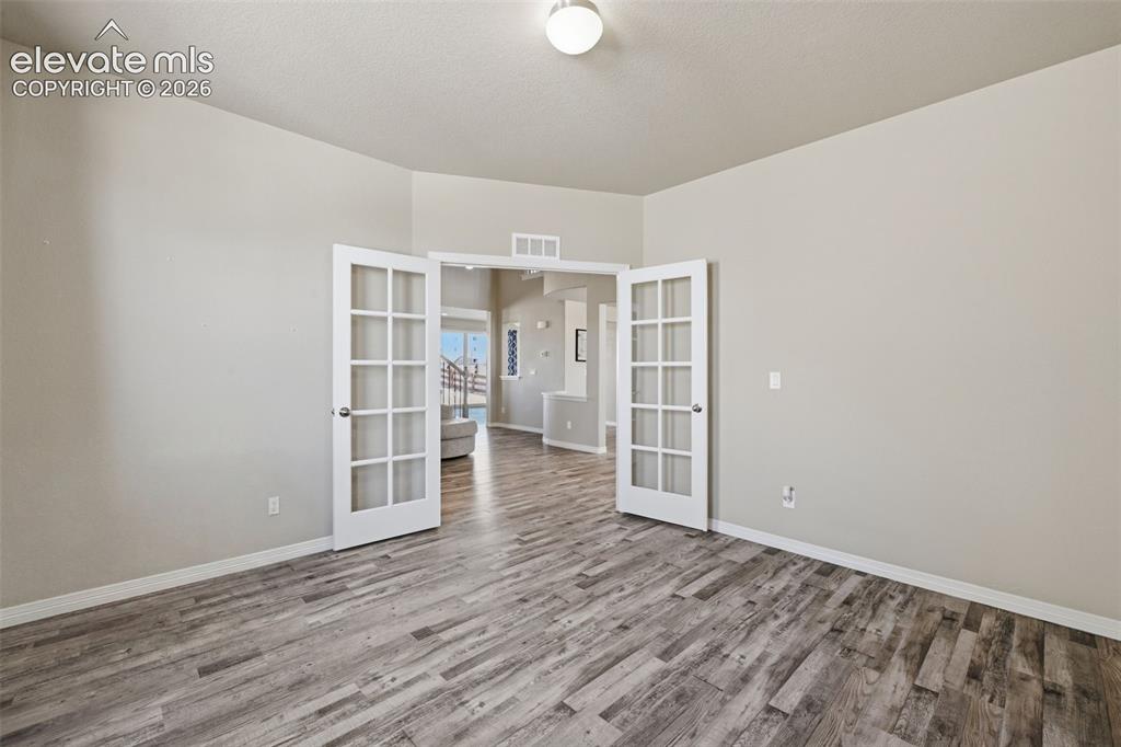 Image 10 of 43: Private Main-Level Office with French Doors