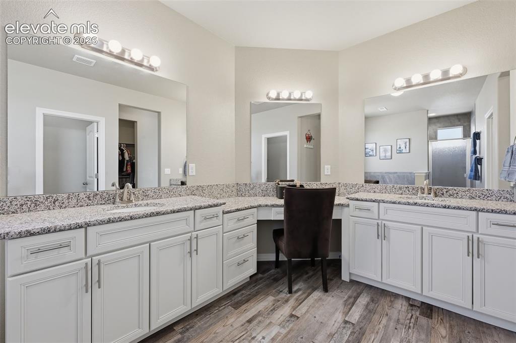 Image 16 of 43: Primary Bath with Dual Vanities