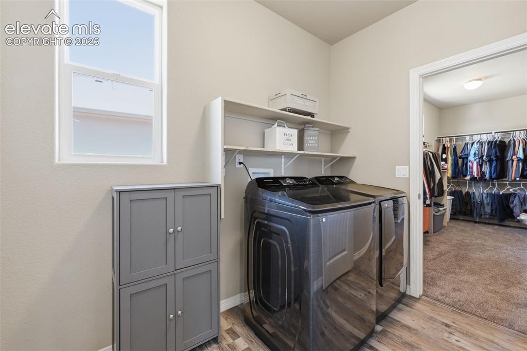 Image 18 of 43: Laundry Room Conveniently Connected to Primary Closet