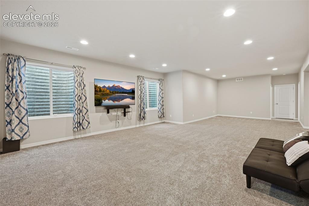 Image 26 of 43: Finished Basement Recreation Space