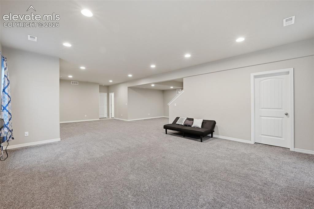 Image 27 of 43: Finished Basement Recreation Space