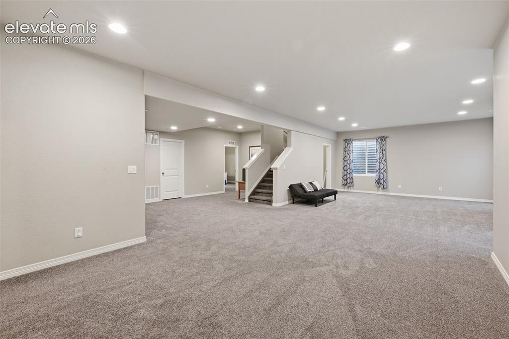Image 28 of 43: Finished Basement Recreation Space