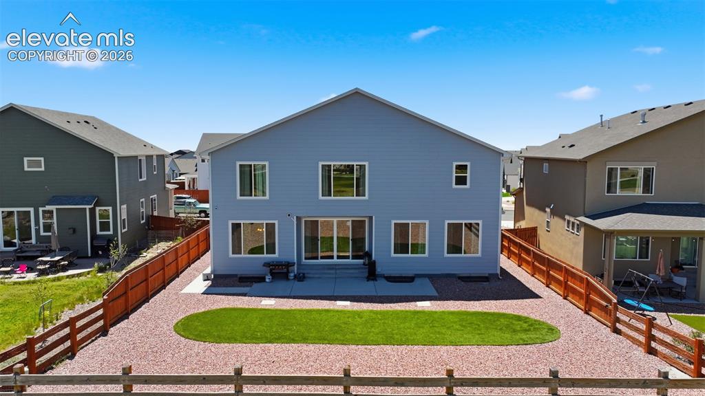 Image 36 of 43: Fully Landscaped and Fenced Backyard