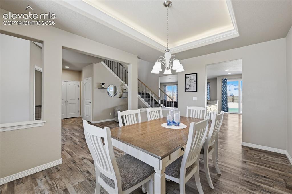 Image 8 of 43: Formal Dining Room with Tray Ceiling