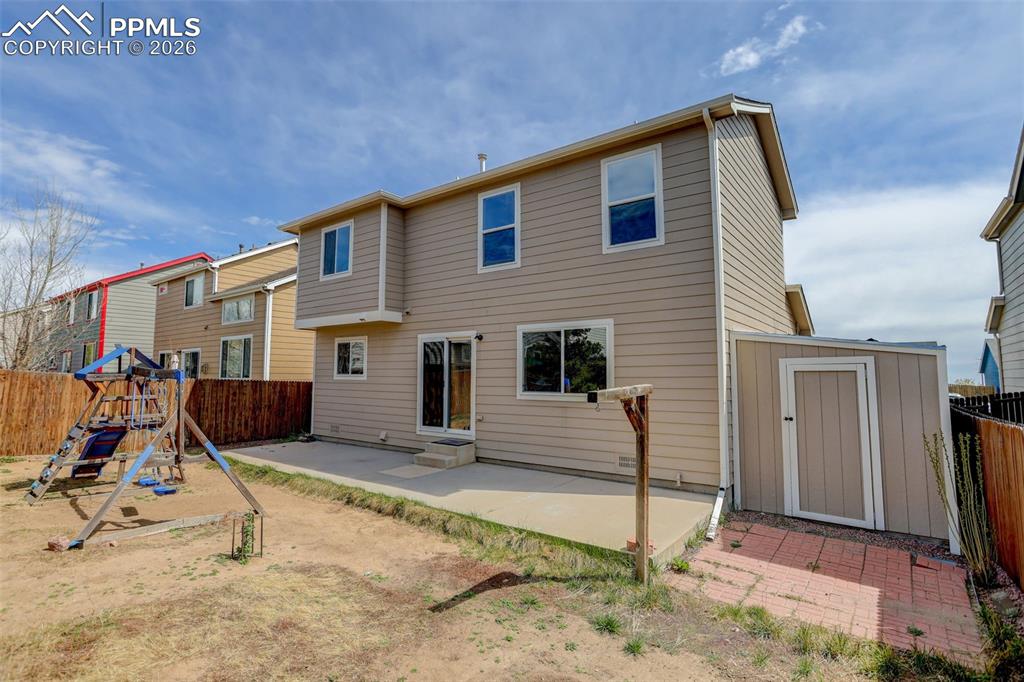 Image 14 of 16: Backyard and Storage shed