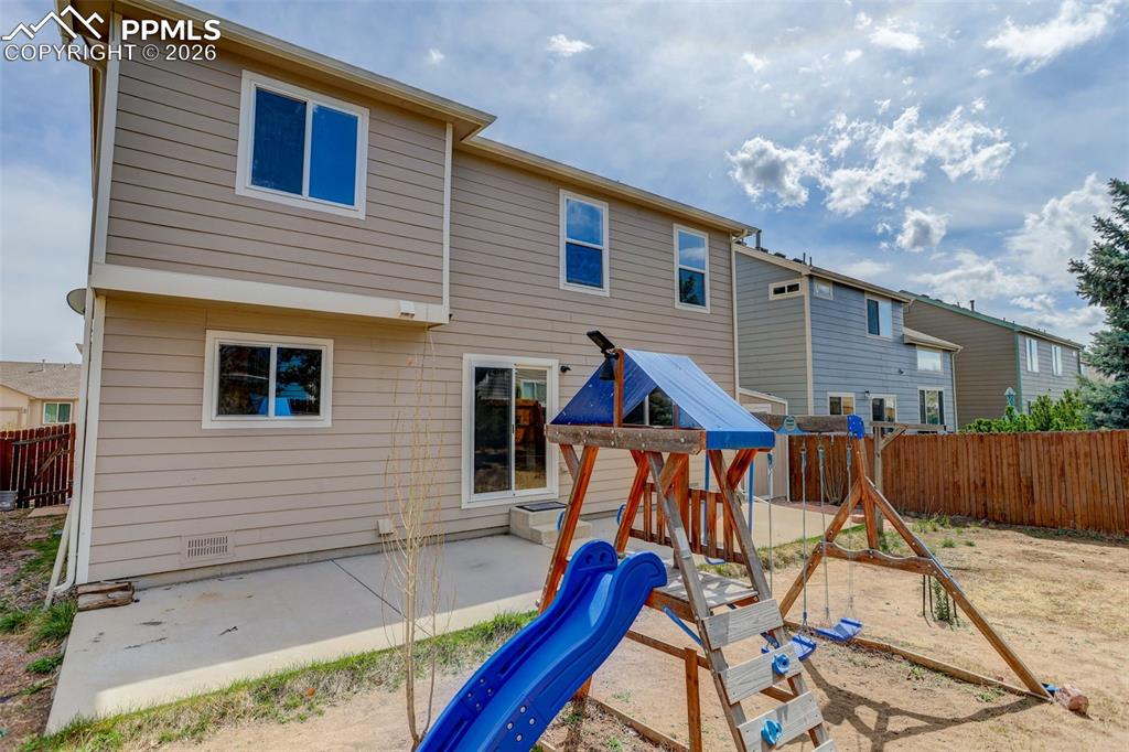 Image 15 of 16: Backyard/patio and play area
