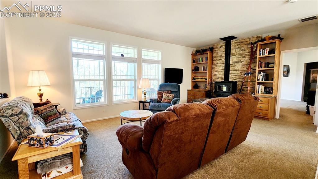 Image 15 of 50: spacious LR with wood burning stove