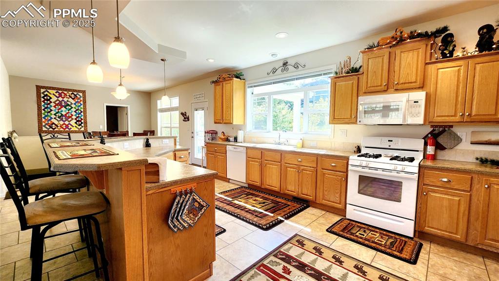 Image 17 of 50: Well appointed kitchen with fabulous views