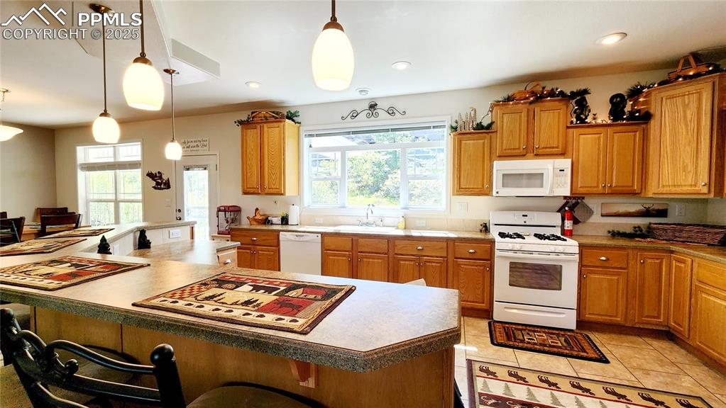 Image 18 of 50: Well appointed kitchen with fabulous views