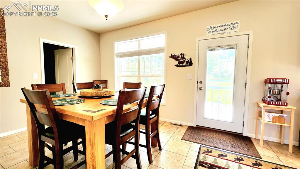 Image 21 of 50: dining table and chairs can stay with the home!