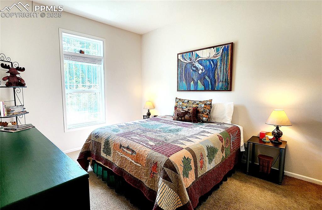 Image 29 of 50: Bedroom 2, The Deer and Moose room! the bed and dresser can stay with the h