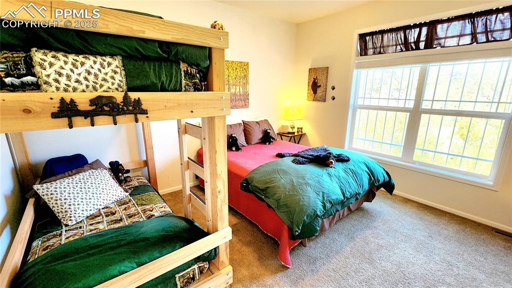Image 31 of 50: Bedroom 3, the Bear Room! Custom made bunk beds and main bed, desk and end 