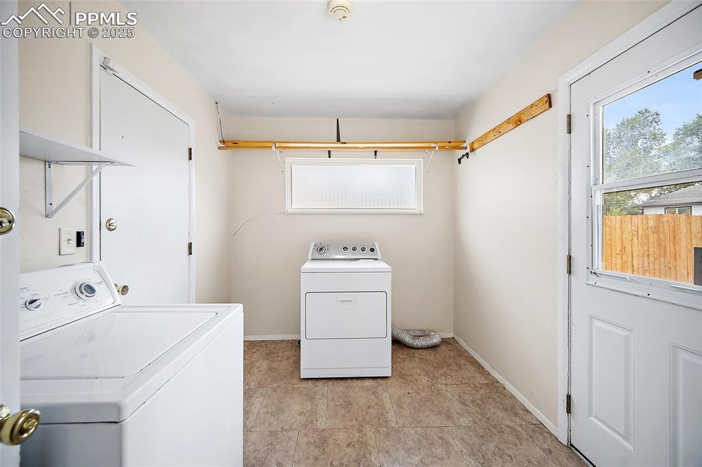Image 26 of 31: Laundry Room & Mud Room - Access to Garage & Backyard