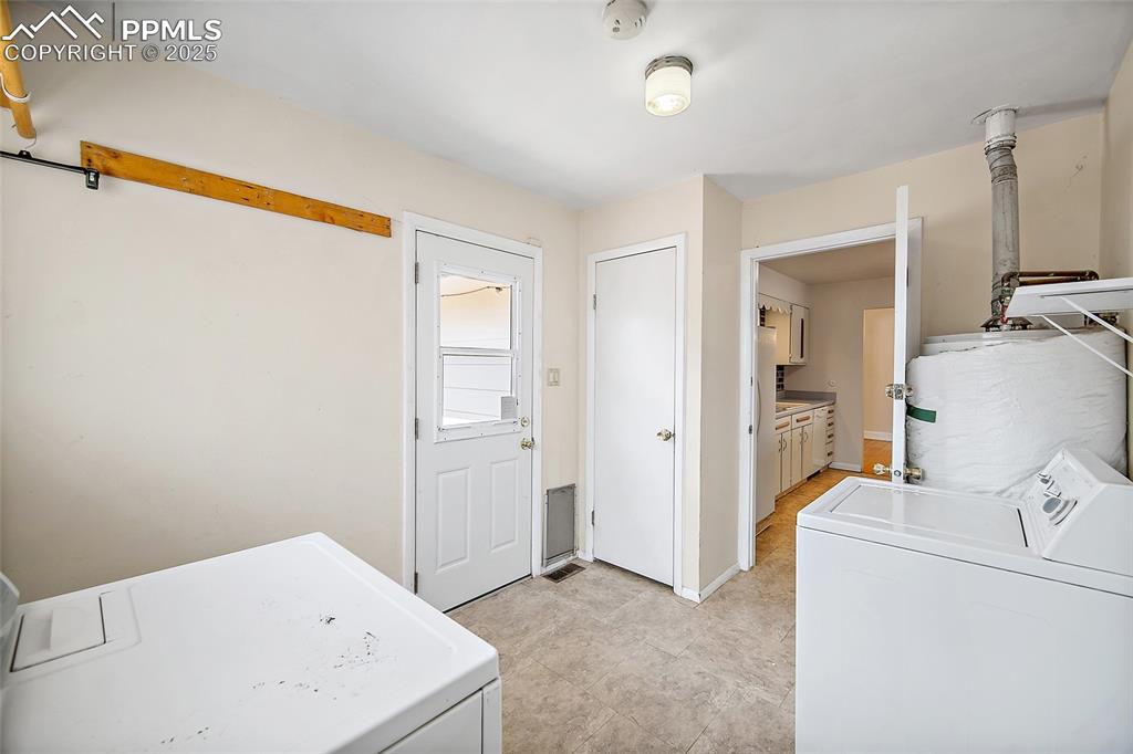 Image 27 of 31: Laundry Room & Mud Room - Access to Garage & Backyard