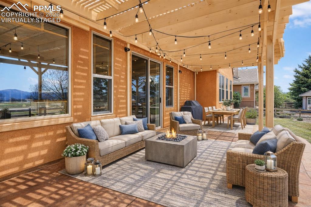 Image 19 of 22: Virtually Staged View of patio / terrace featuring an outdoor living / dini