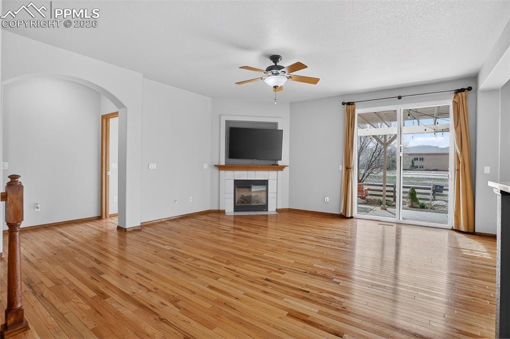 Image 4 of 22: Unfurnished living room featuring ceiling fan, light wood finished floors,