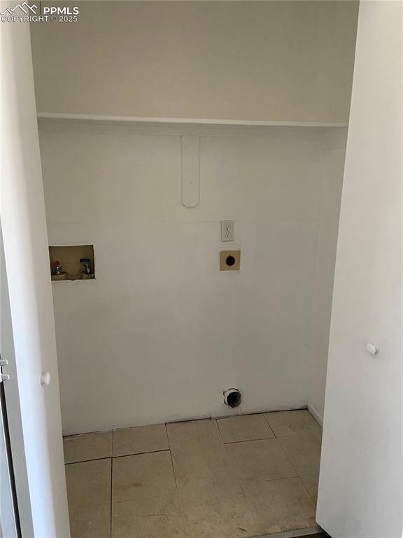 Image 7 of 8: Laundry room featuring hookup for an electric dryer, tile patterned floors,