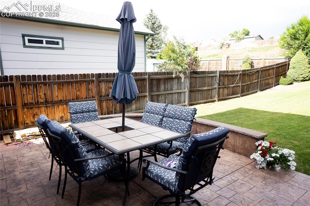Image 22 of 48: View of patio featuring outdoor dining area