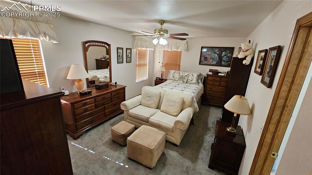 Image 28 of 48: Bedroom with carpet floors and ceiling fan