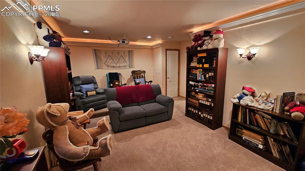 Image 35 of 48: Home theater featuring light colored carpet and recessed lighting