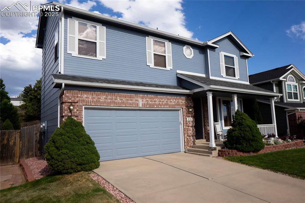 Image 4 of 48: View of property exterior with a porch