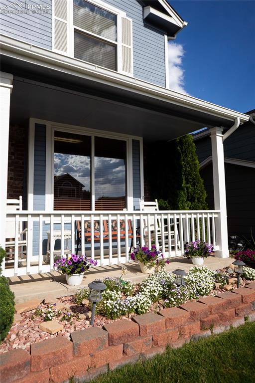Image 6 of 48: Property entrance featuring a porch