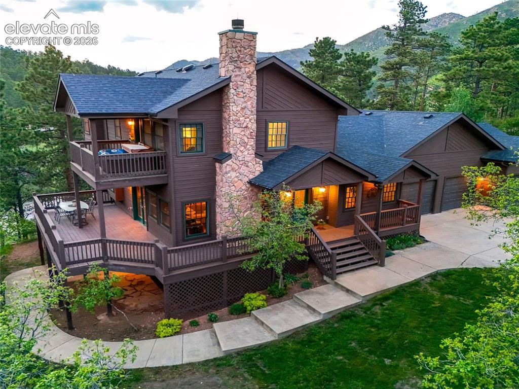 Image 2 of 50: The classic mountain design provides space for hosting and privacy. From th