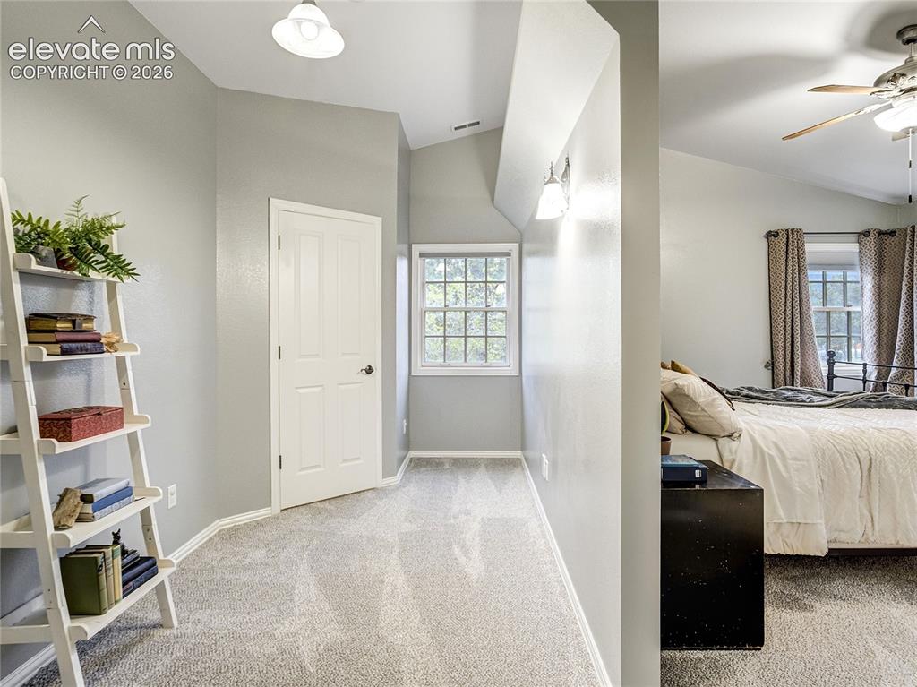 Image 25 of 50: The primary suite features a sitting room space, and ideal nook set aside f