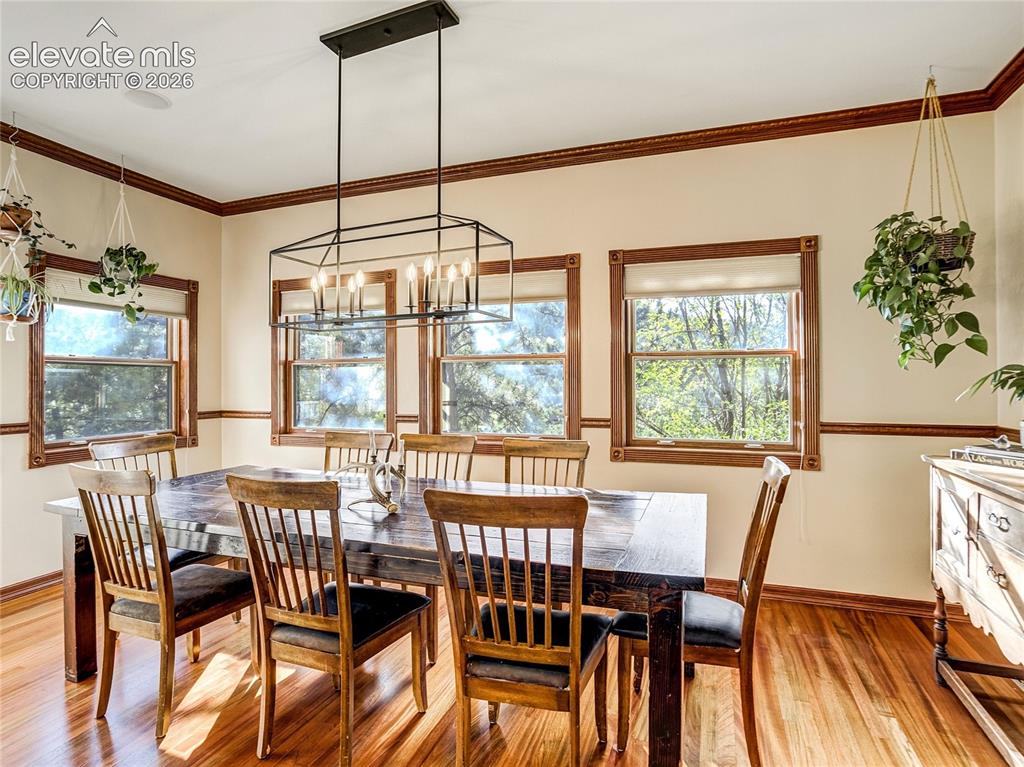 Image 6 of 50: Just beyond the kitchen, the private dining room feels like you are dining