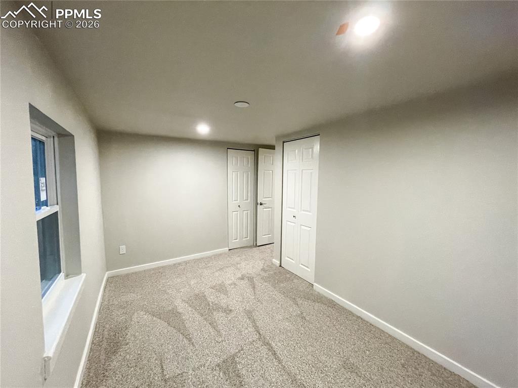 Image 17 of 24: Hallway featuring wood-finish flooring, recessed lighting, and neutral wall