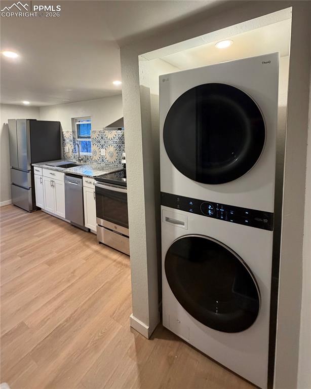 Image 19 of 24: Room featuring a decorative accent wall with geometric paneling, wood-finis
