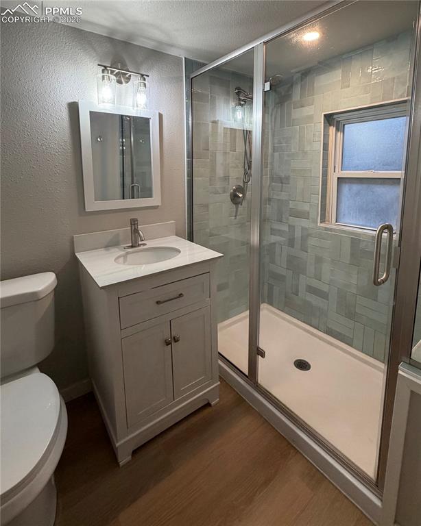 Image 20 of 24: Integrated laundry center featuring a stackable washer and dryer within a d