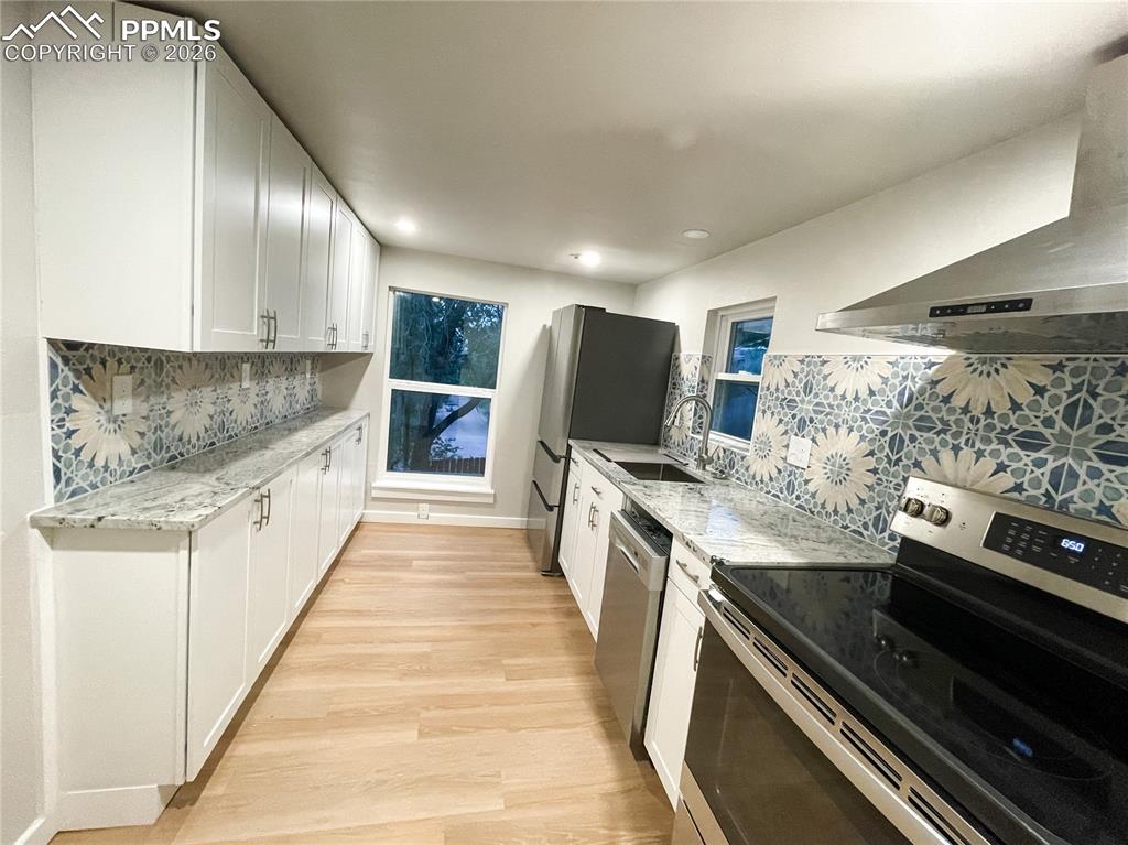 Image 22 of 24: Carpeted room featuring a double-hung window, light-toned walls, recessed l