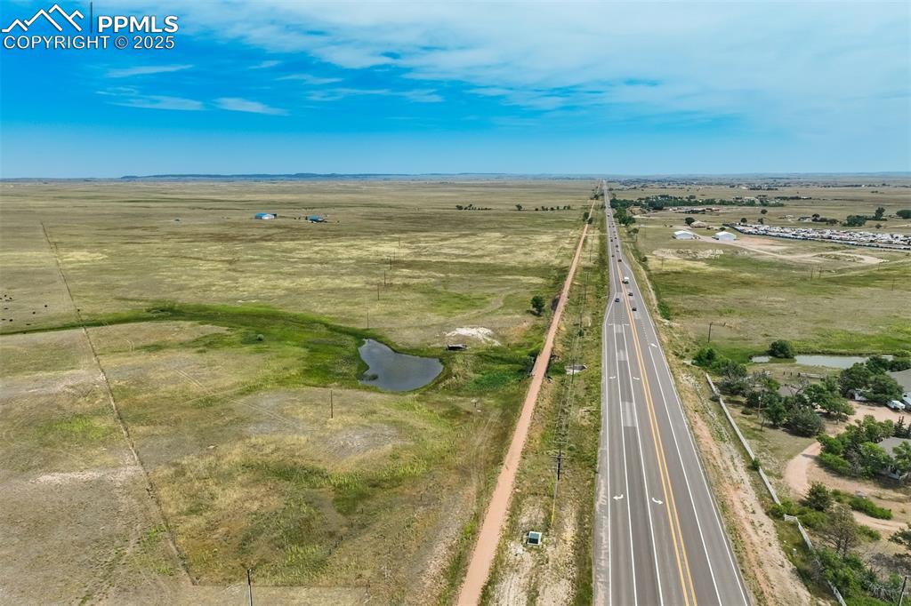 Image 49 of 50: Overview of rural landscape with a large body of water