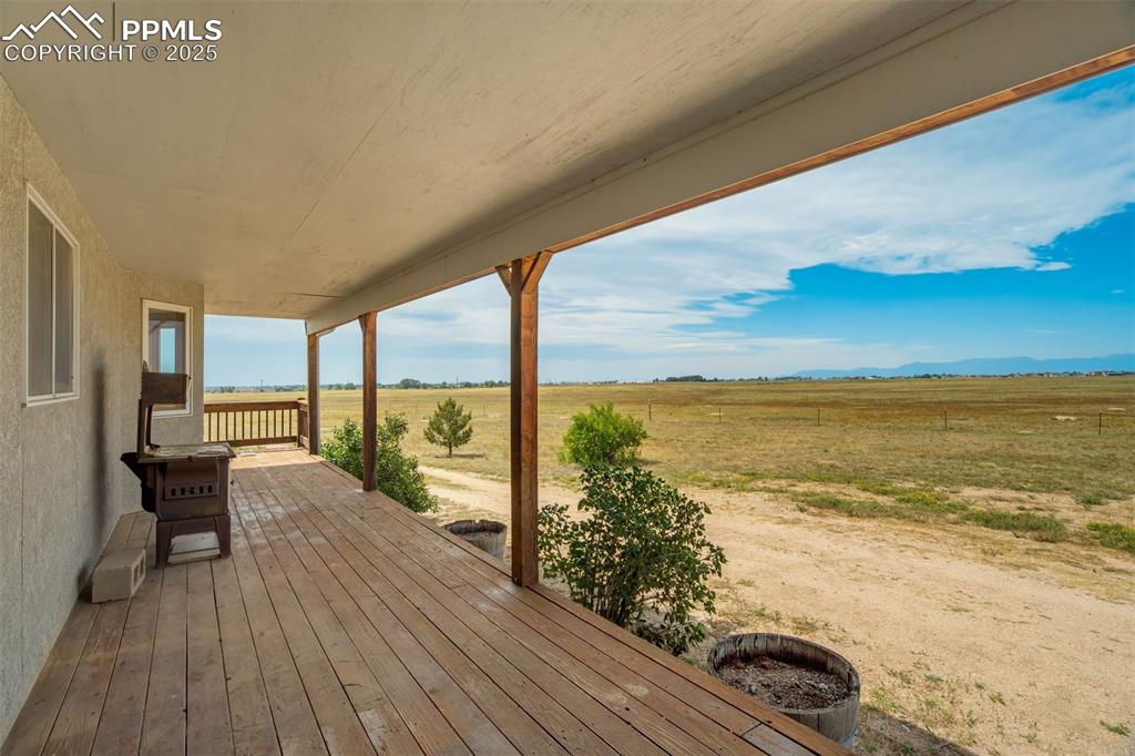 Image 6 of 50: Wooden terrace with a view of rural / pastoral area