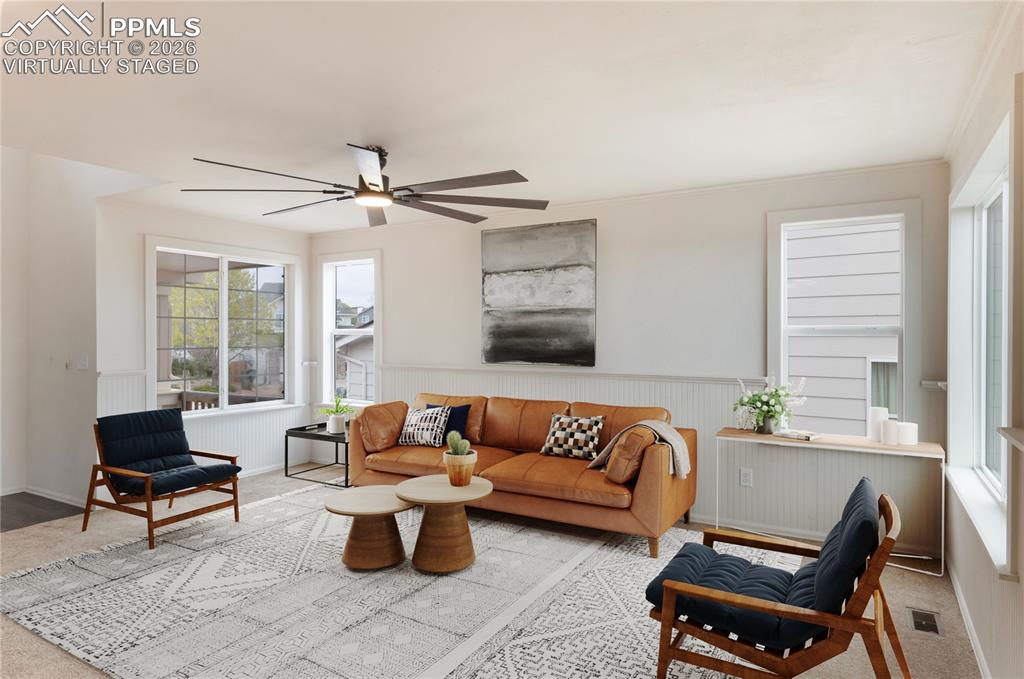 Image 3 of 43:  virtually staged   Spacious living area featuring large  windows, a modern
