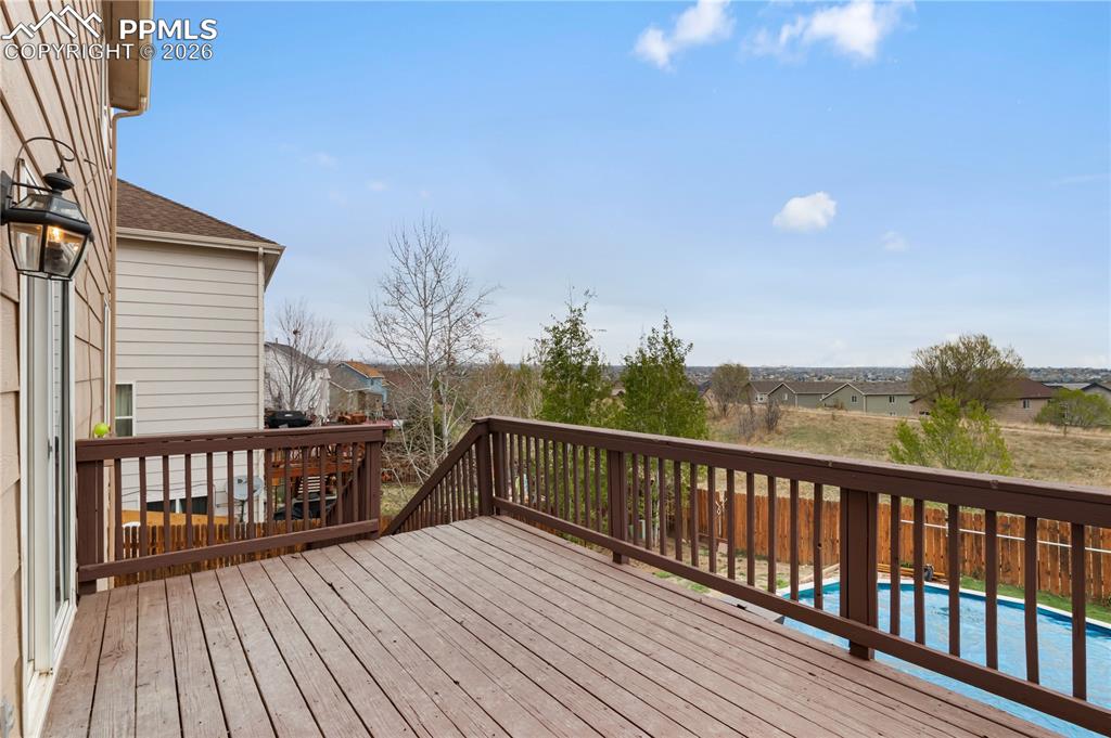 Image 33 of 43: The property features an outdoor deck with wooden planks and railings, offe