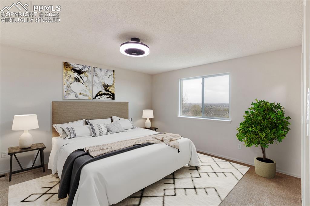 Image 5 of 43: virtually staged This bedroom features a window providing  natural light, a