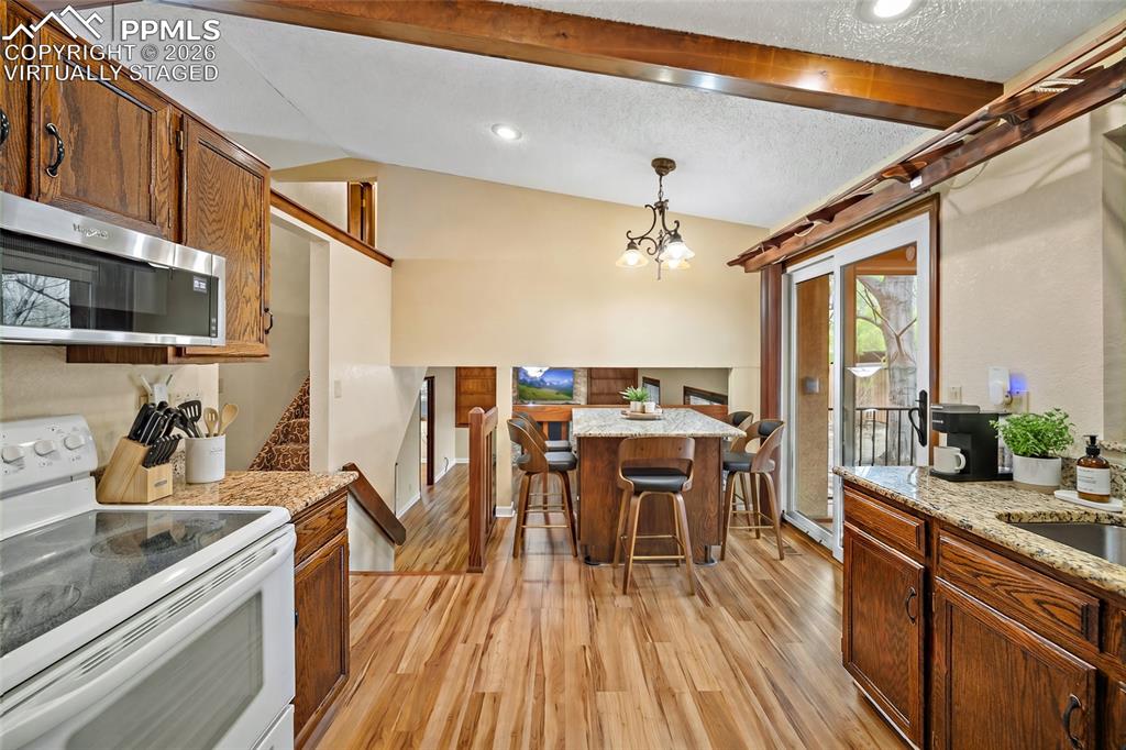 Image 13 of 50: virtually staged Breakfast Island!
