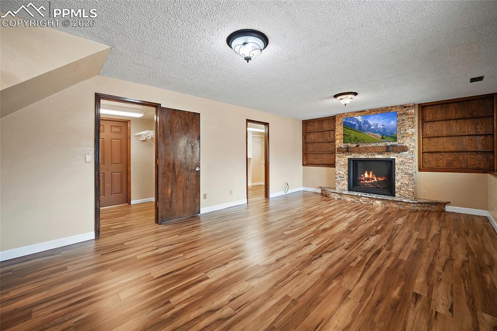 Image 23 of 50: Family room with waterproof luxury vinyl.  
