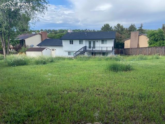Image 19 of 26: Back of property featuring a deck