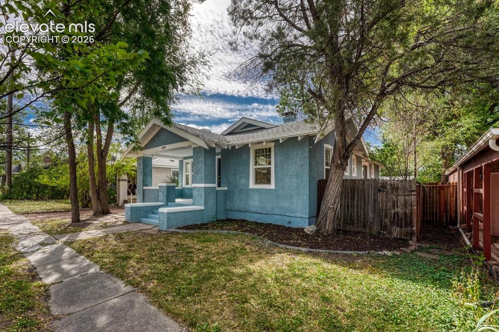 Image 3 of 44: Exterior featuring a covered porch, stucco siding, a gabled roof, and estab