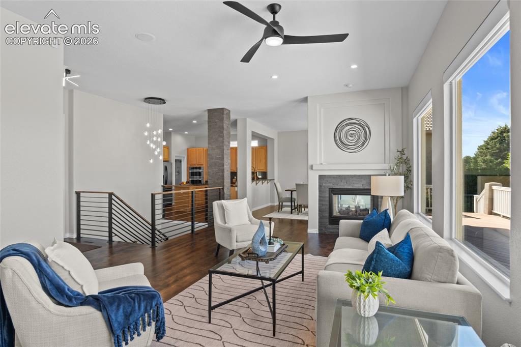 Image 14 of 44: Real Maple hardwood flows throughout the main floor and down the open stair