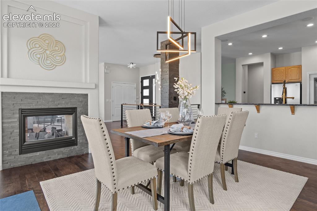 Image 16 of 44: Dual sided Gas Fireplace for cozy evenings and ambiance.
