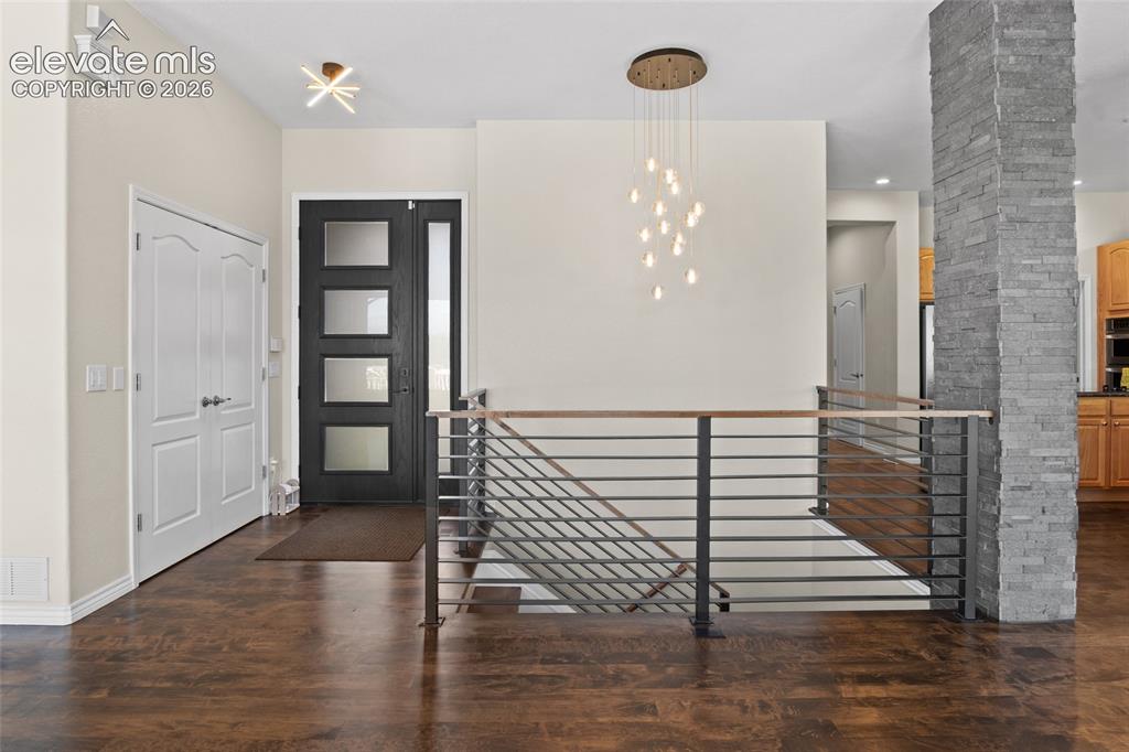Image 22 of 50: Custom built Therma-Tru door with sidelight & stunning Maple Hardwood floor