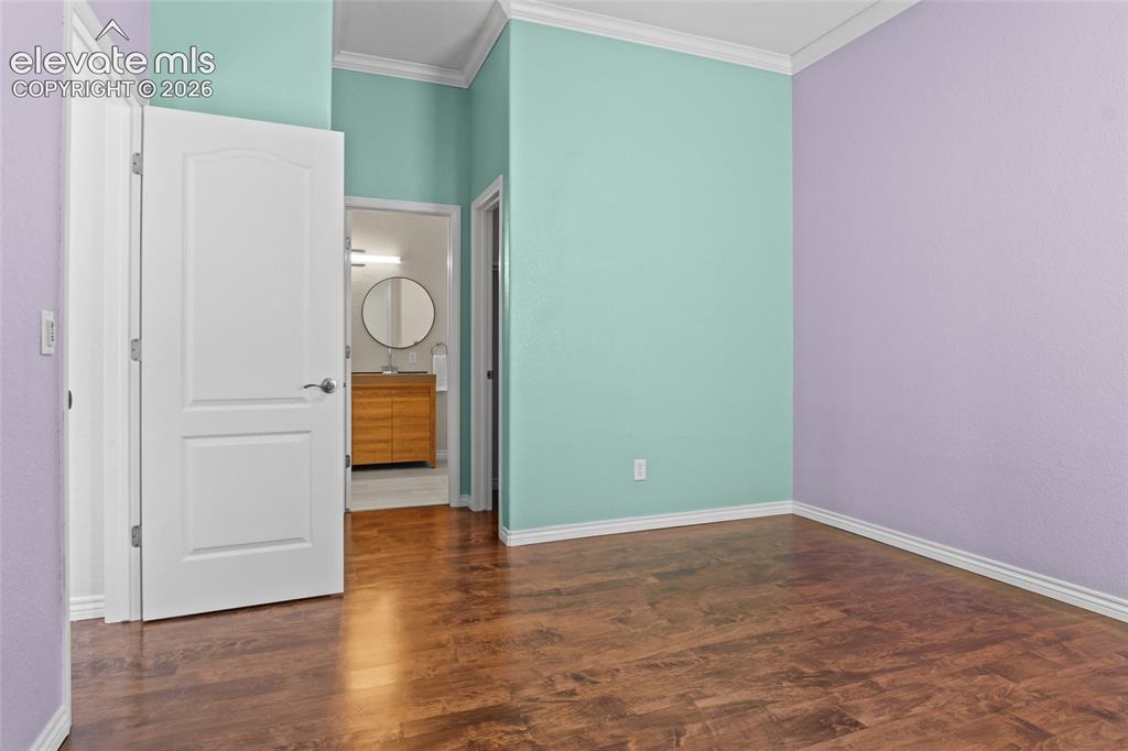 Image 23 of 50: Secondary bedroom on main floor attached to Jack n Jill bath