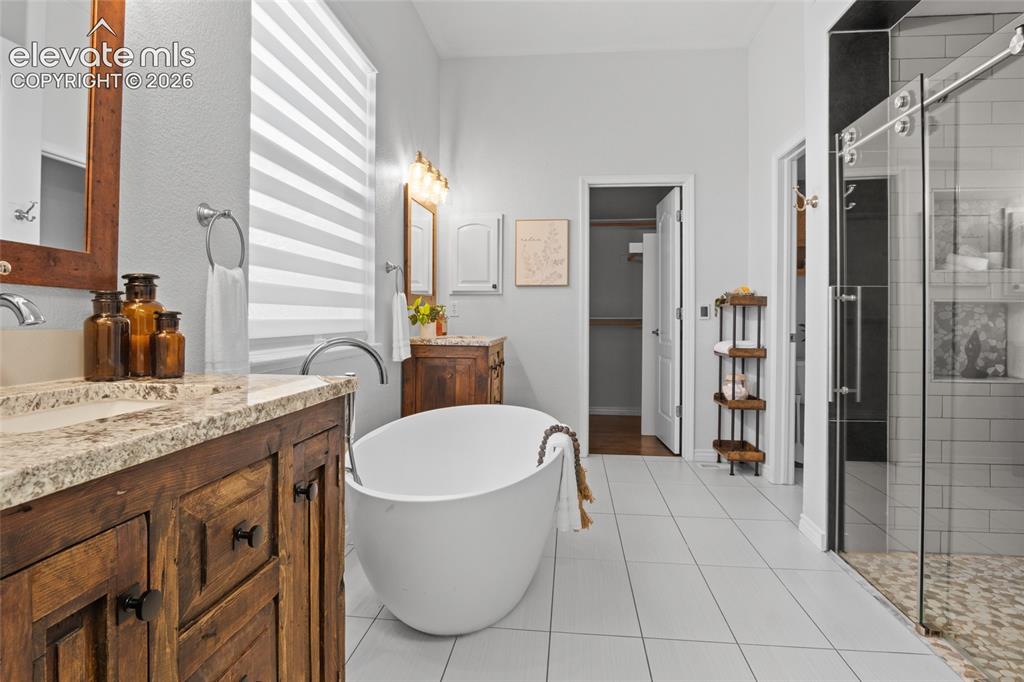Image 23 of 44: En-Suite Primary bath features a beautiful Soaker tub, Smart control heated